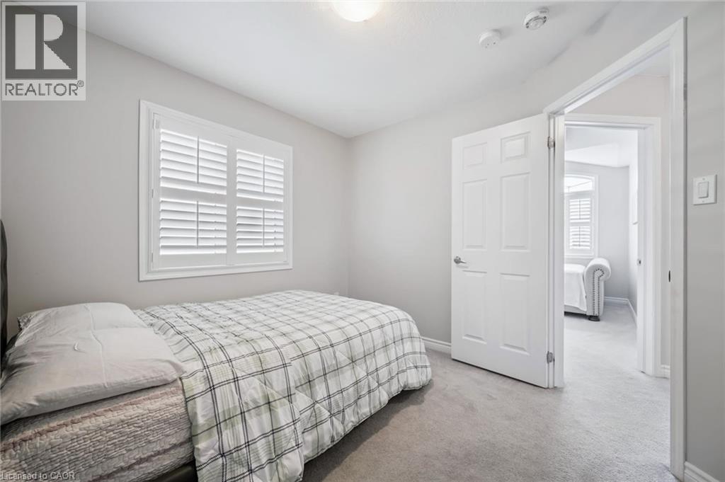 Bedroom with light colored carpet and baseboards - 38 Park Glen Street, Kitchener, ON - Indoor Photo Showing Bedroom