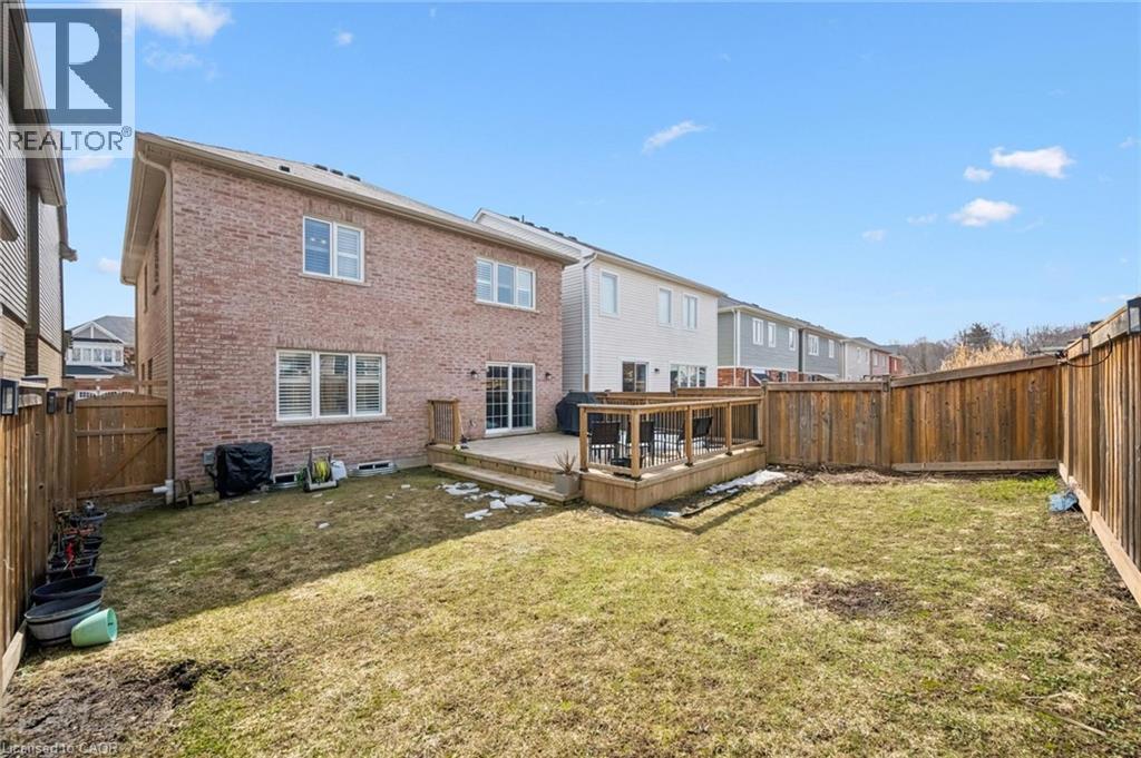 Back of property with brick siding, a deck, a gate, and a fenced backyard - 38 Park Glen Street, Kitchener, ON - Outdoor With Deck Patio Veranda With Exterior