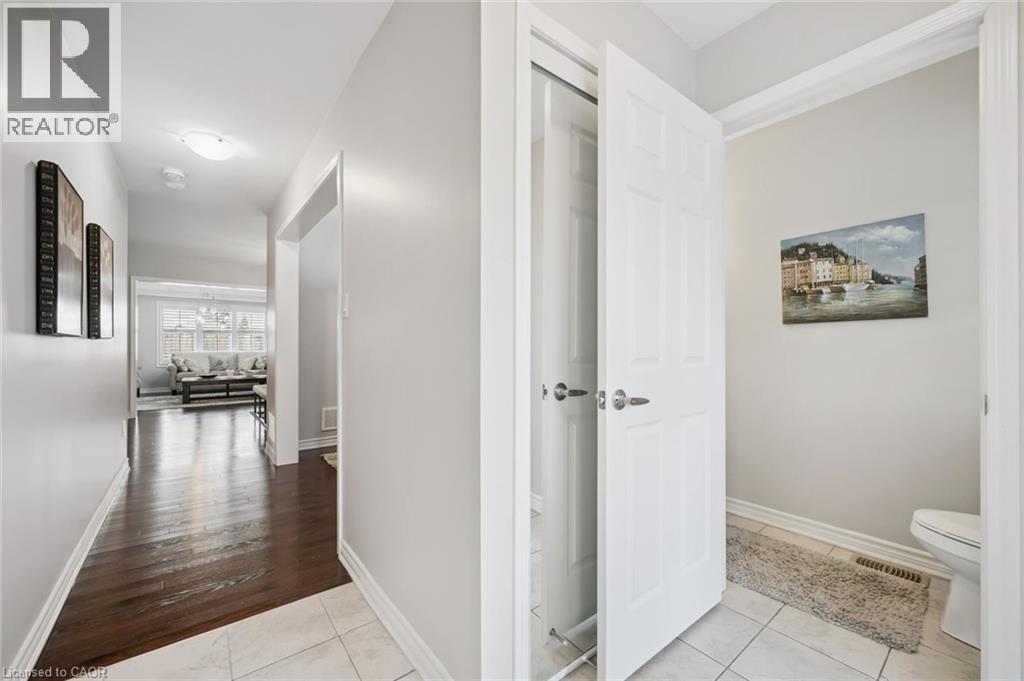 Hallway featuring light tile patterned flooring and baseboards - 38 Park Glen Street, Kitchener, ON - Indoor Photo Showing Other Room