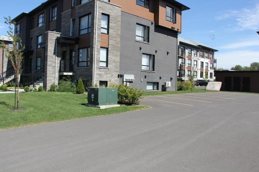 Parking - 3888 Rue Bernard-Hubert, Longueuil (Saint-Hubert), QC - Outdoor With Facade