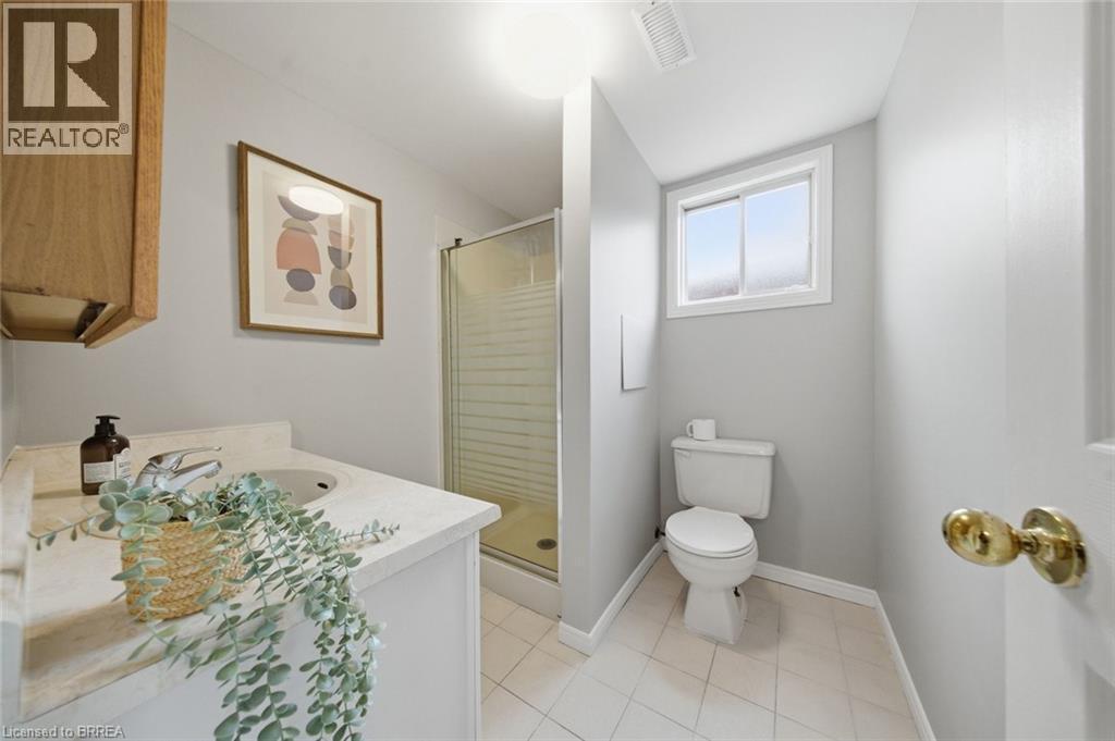 Bathroom with vanity, a stall shower, and light tile patterned flooring - 7 Forest Drive, Paris, ON - Indoor Photo Showing Bathroom