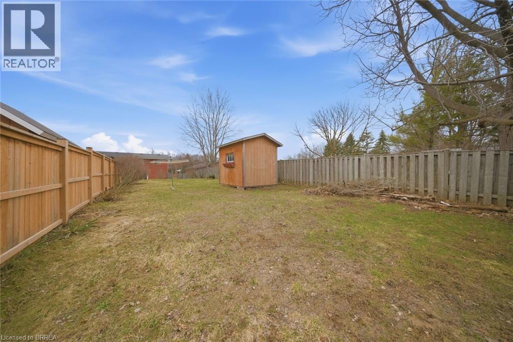 Fenced backyard with a storage unit - 7 Forest Drive, Paris, ON - Outdoor
