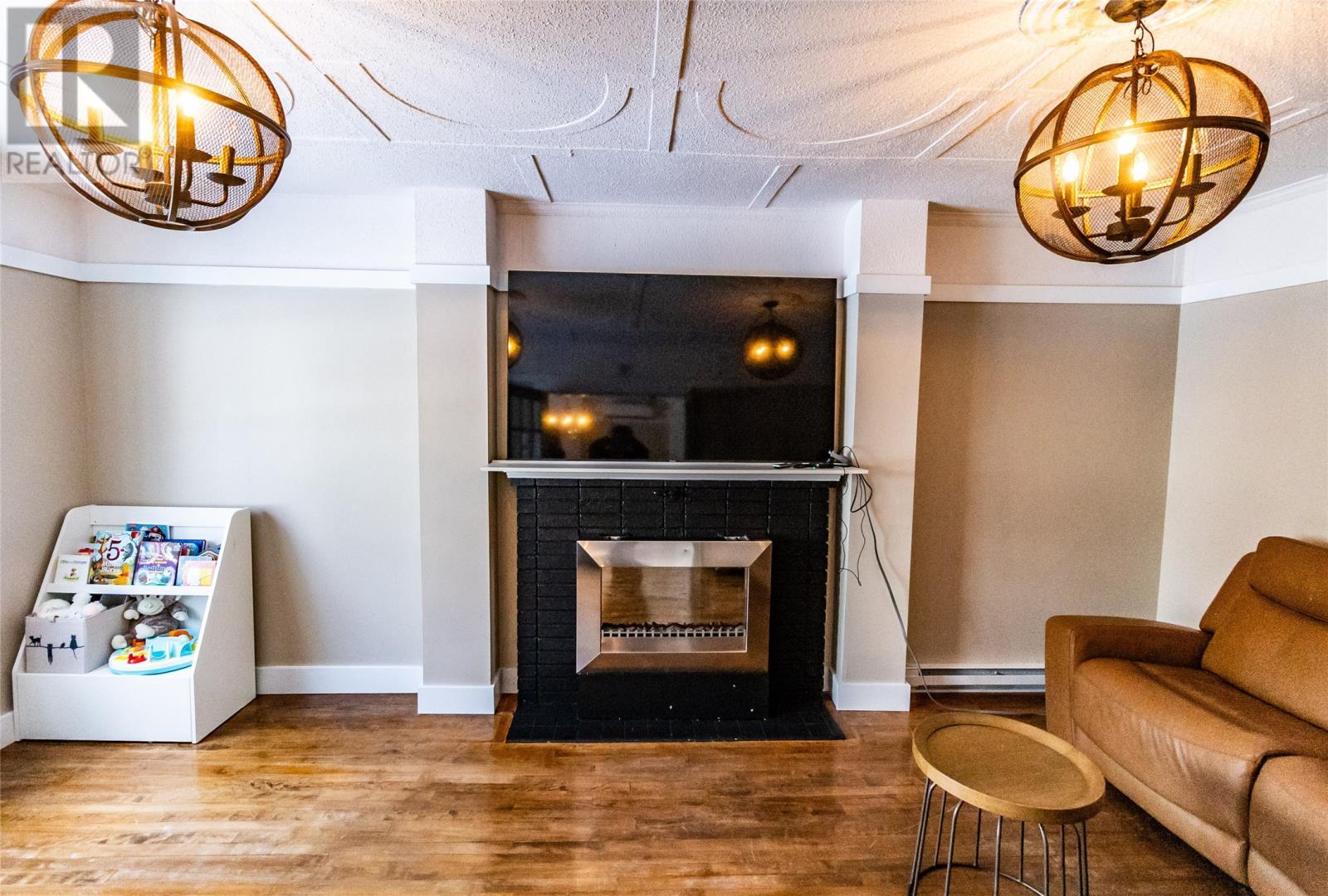 12 Upper Nicholsville Road, Deer Lake, NL - Indoor Photo Showing Living Room With Fireplace