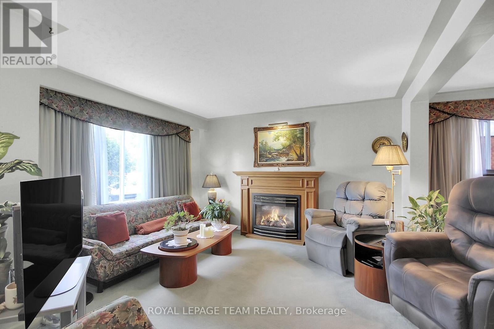 962 Dynes Road, Ottawa, ON - Indoor Photo Showing Living Room With Fireplace
