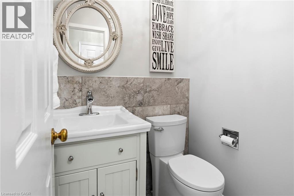 Bathroom with vanity and tile walls - 18 Webster Way, Georgetown, ON - Indoor Photo Showing Bathroom