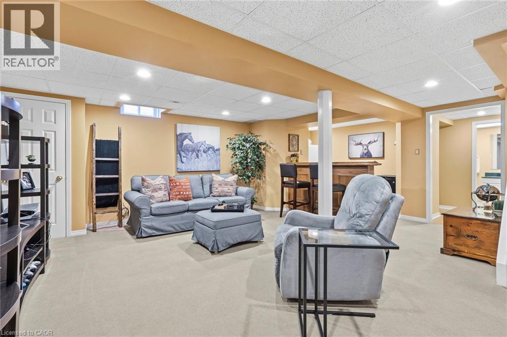 Living area with light colored carpet, a drop ceiling, and recessed lighting - 18 Webster Way, Georgetown, ON - Indoor