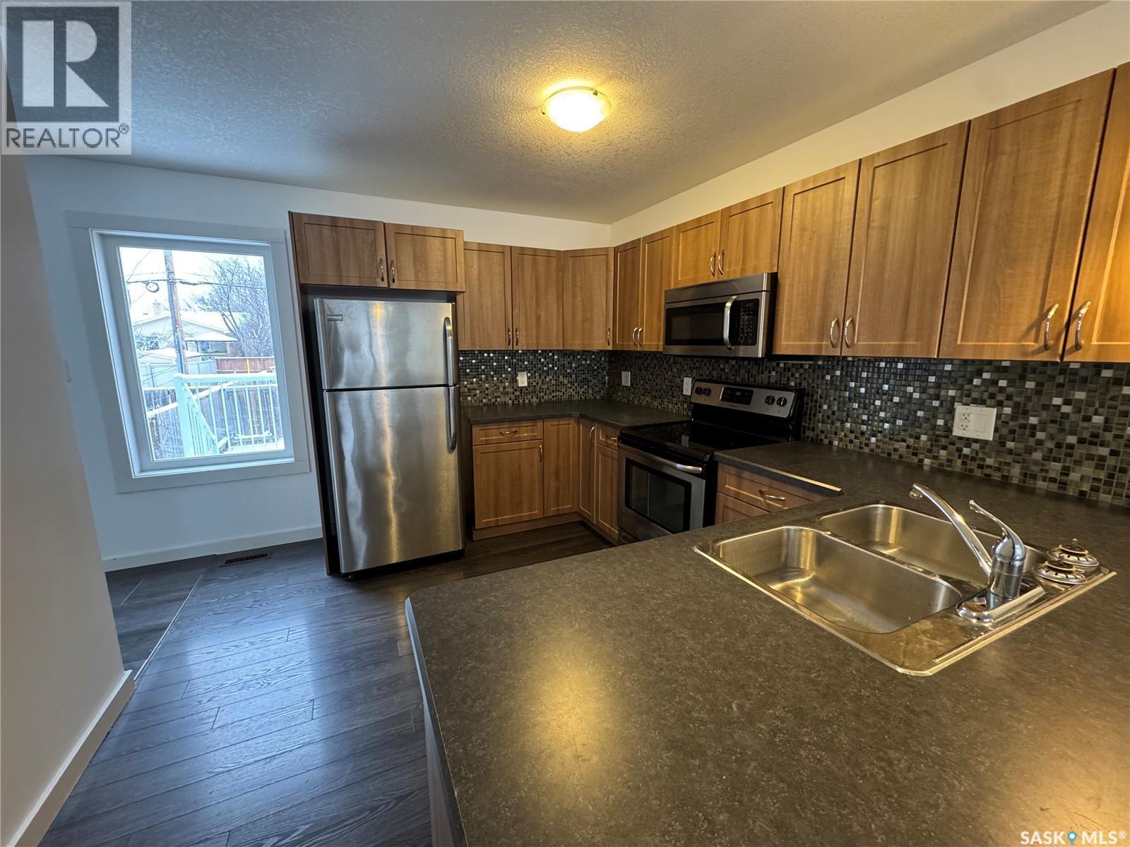 527 Alexandra Street, Weyburn, SK - Indoor Photo Showing Kitchen With Double Sink