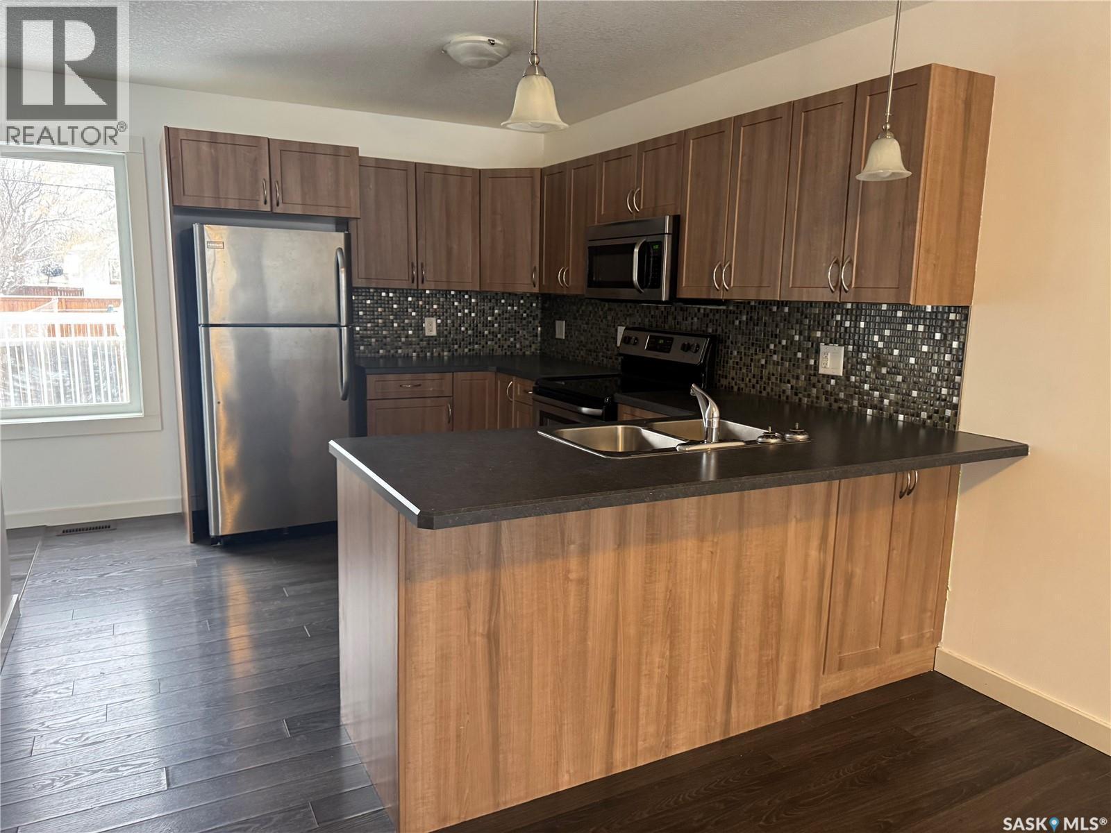 527 Alexandra Street, Weyburn, SK - Indoor Photo Showing Kitchen With Double Sink