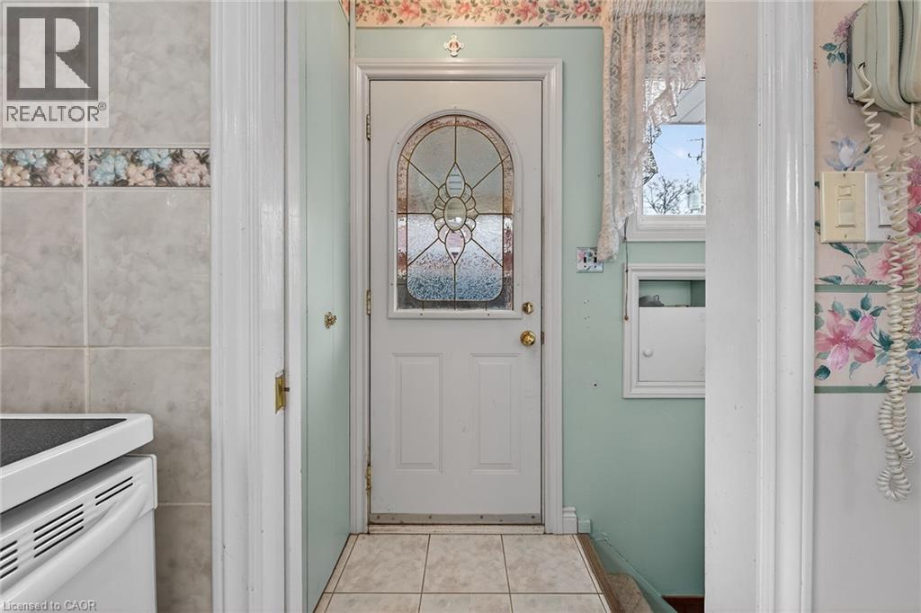 Doorway featuring tile patterned floors - 21 Bluebird Avenue, Hamilton, ON - Indoor Photo Showing Other Room