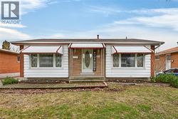 View of front facade with a front yard -