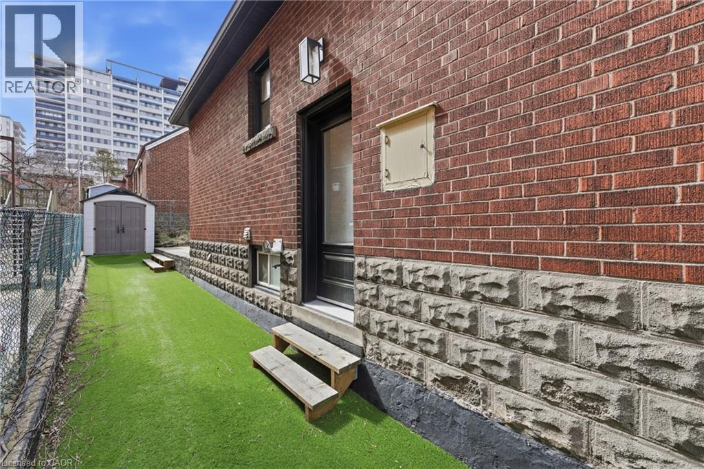 Property entrance with brick siding - 129 Jackson Street W, Hamilton, ON - Outdoor With Exterior