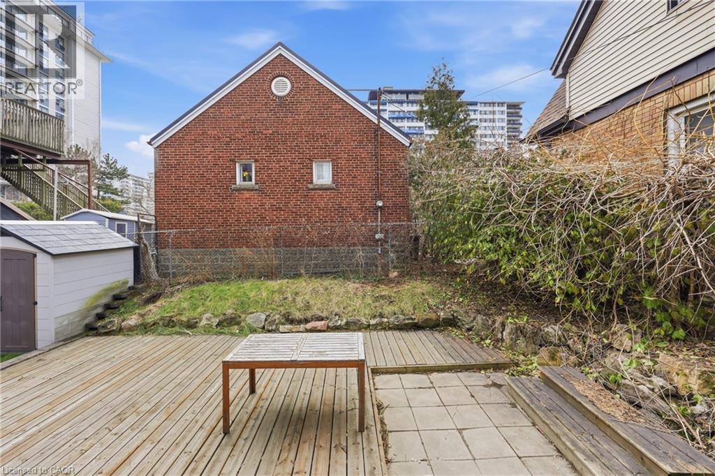 Wooden deck with a storage unit - 129 Jackson Street W, Hamilton, ON - Outdoor