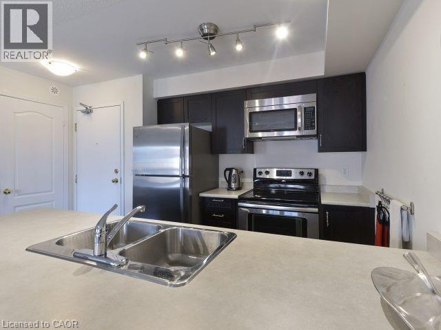 129 Isaac Devins Boulevard Unit# 7, Toronto, ON - Indoor Photo Showing Kitchen With Double Sink With Upgraded Kitchen