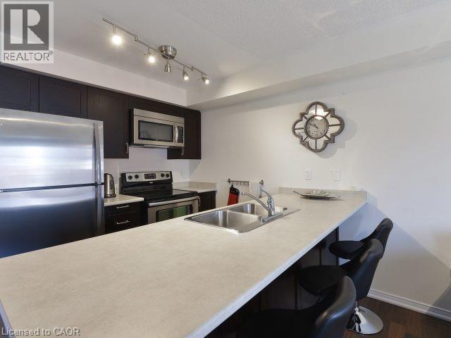 129 Isaac Devins Boulevard Unit# 7, Toronto, ON - Indoor Photo Showing Kitchen With Double Sink With Upgraded Kitchen
