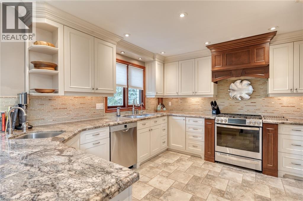 Kitchen featuring stainless steel appliances, open shelves, recessed lighting, light stone countertops, and decorative backsplash - 15 Marquette Drive, Kitchener, ON - Indoor Photo Showing Kitchen With Upgraded Kitchen
