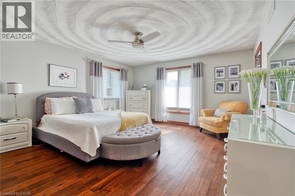 Bedroom featuring dark wood-style flooring and a ceiling fan - 15 Marquette Drive, Kitchener, ON - Indoor Photo Showing Bedroom