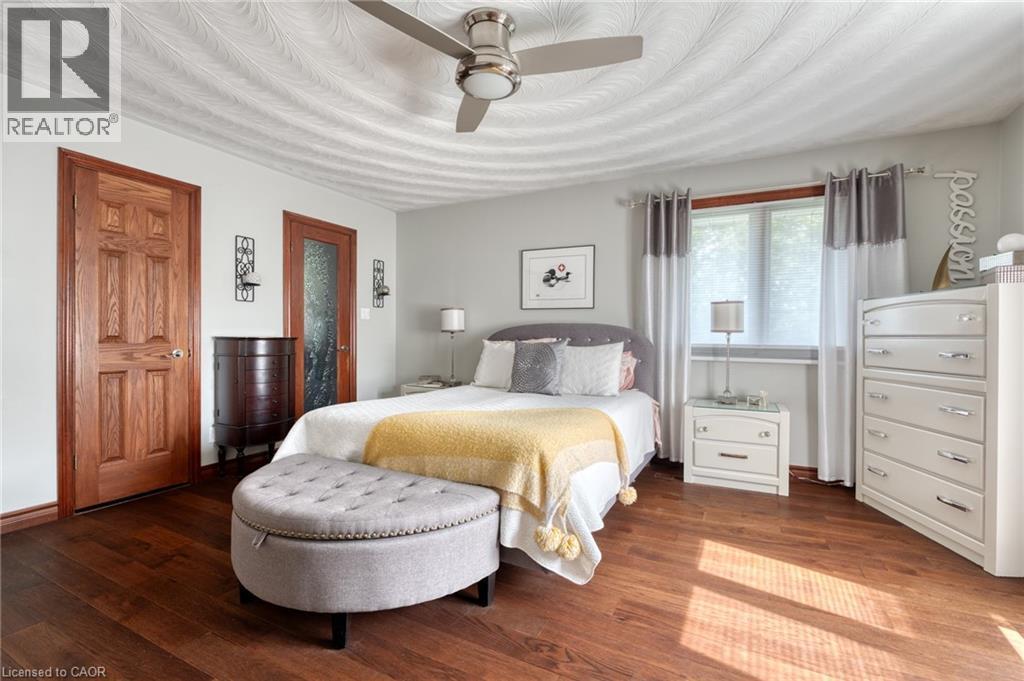 Bedroom with hardwood / wood-style floors and ceiling fan - 15 Marquette Drive, Kitchener, ON - Indoor Photo Showing Bedroom
