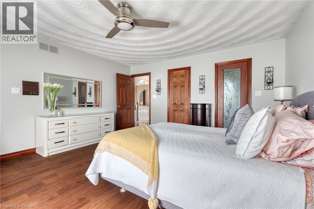 Bedroom featuring a ceiling fan and dark wood-style flooring - 15 Marquette Drive, Kitchener, ON - Indoor Photo Showing Bedroom