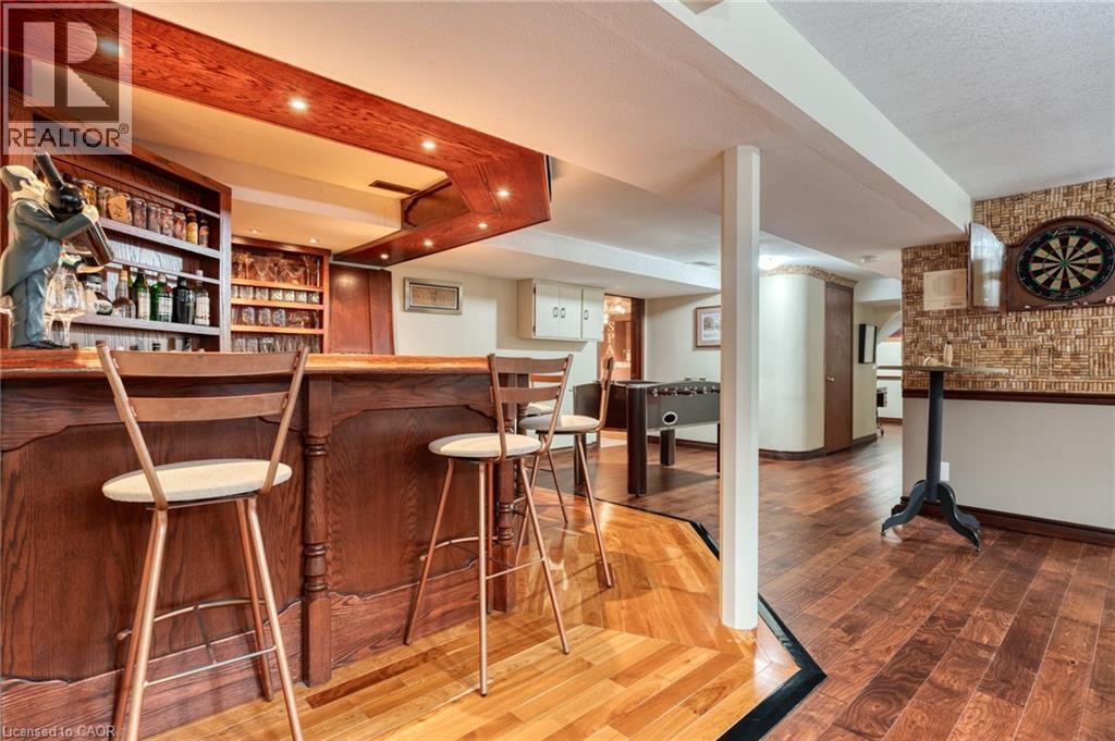 Indoor dry bar featuring light wood-style flooring and open shelves - 15 Marquette Drive, Kitchener, ON - Indoor Photo Showing Other Room