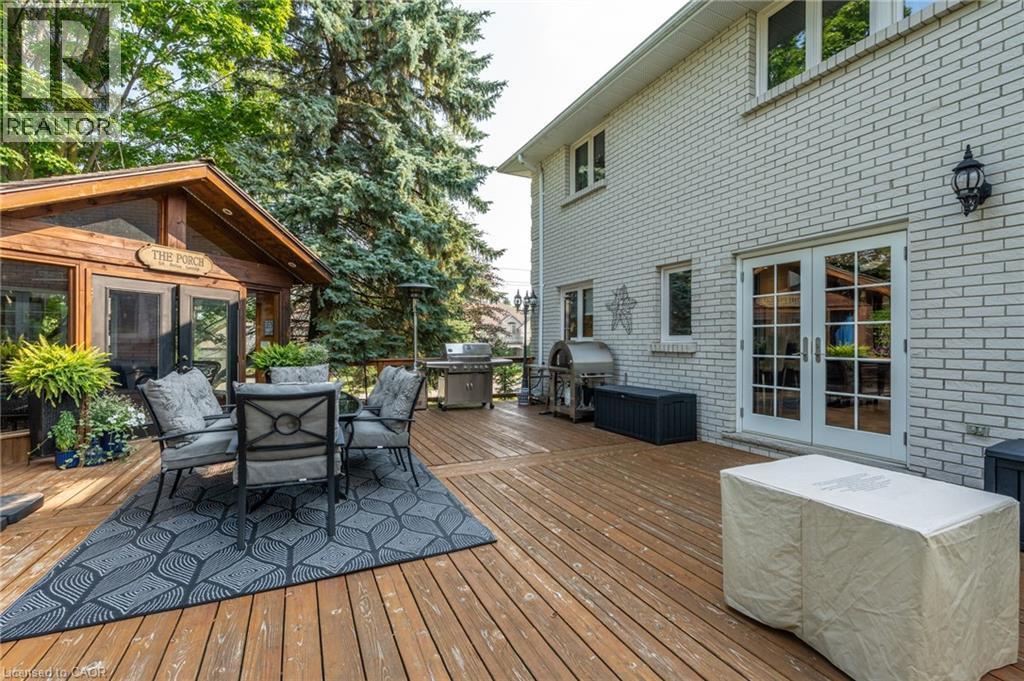 Deck with french doors, area for grilling, and outdoor dining area - 15 Marquette Drive, Kitchener, ON - Outdoor With Deck Patio Veranda With Exterior