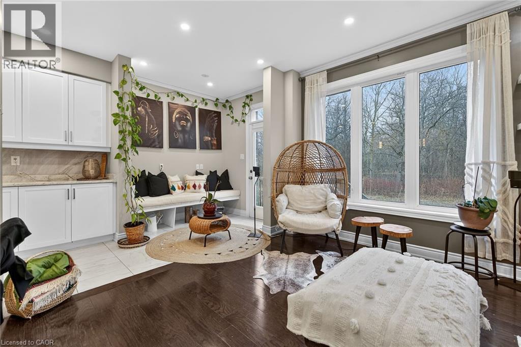 Sitting room with light wood-type flooring and recessed lighting - 7809 Hackberry Trail E, Niagara Falls, ON - Indoor Photo Showing Living Room