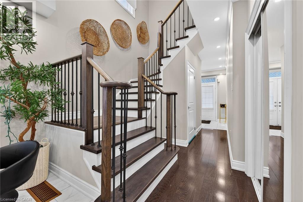 Stairway with baseboards and recessed lighting - 7809 Hackberry Trail E, Niagara Falls, ON - Indoor Photo Showing Other Room