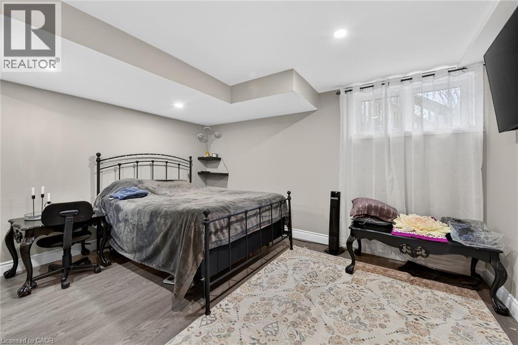 Bedroom featuring light wood-style floors and recessed lighting - 7809 Hackberry Trail E, Niagara Falls, ON - Indoor Photo Showing Bedroom