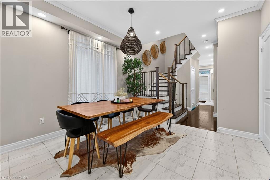 Dining room featuring light marble finish floors, recessed lighting, and ornamental molding - 7809 Hackberry Trail E, Niagara Falls, ON - Indoor Photo Showing Other Room