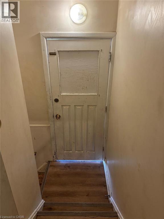 Doorway to outside featuring hardwood / wood-style flooring - 1224 Dunsmure Road, Hamilton, ON - Indoor Photo Showing Other Room