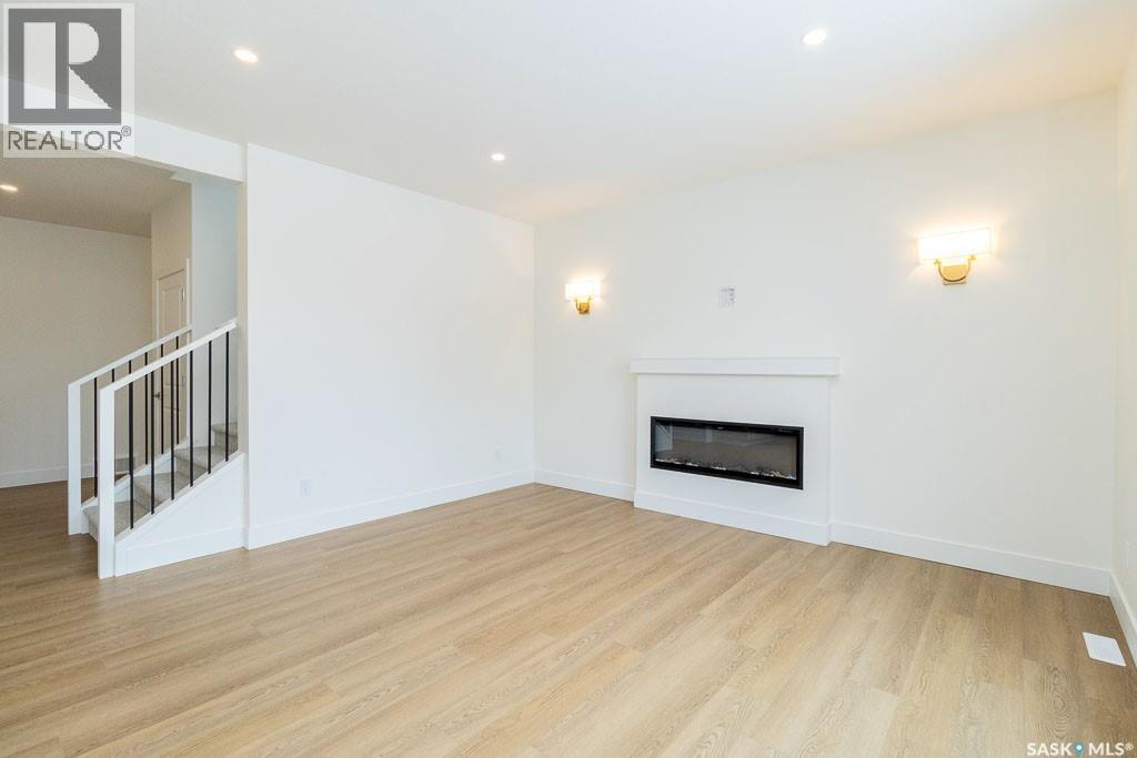 150 Mazurek Crescent, Saskatoon, SK - Indoor Photo Showing Living Room With Fireplace