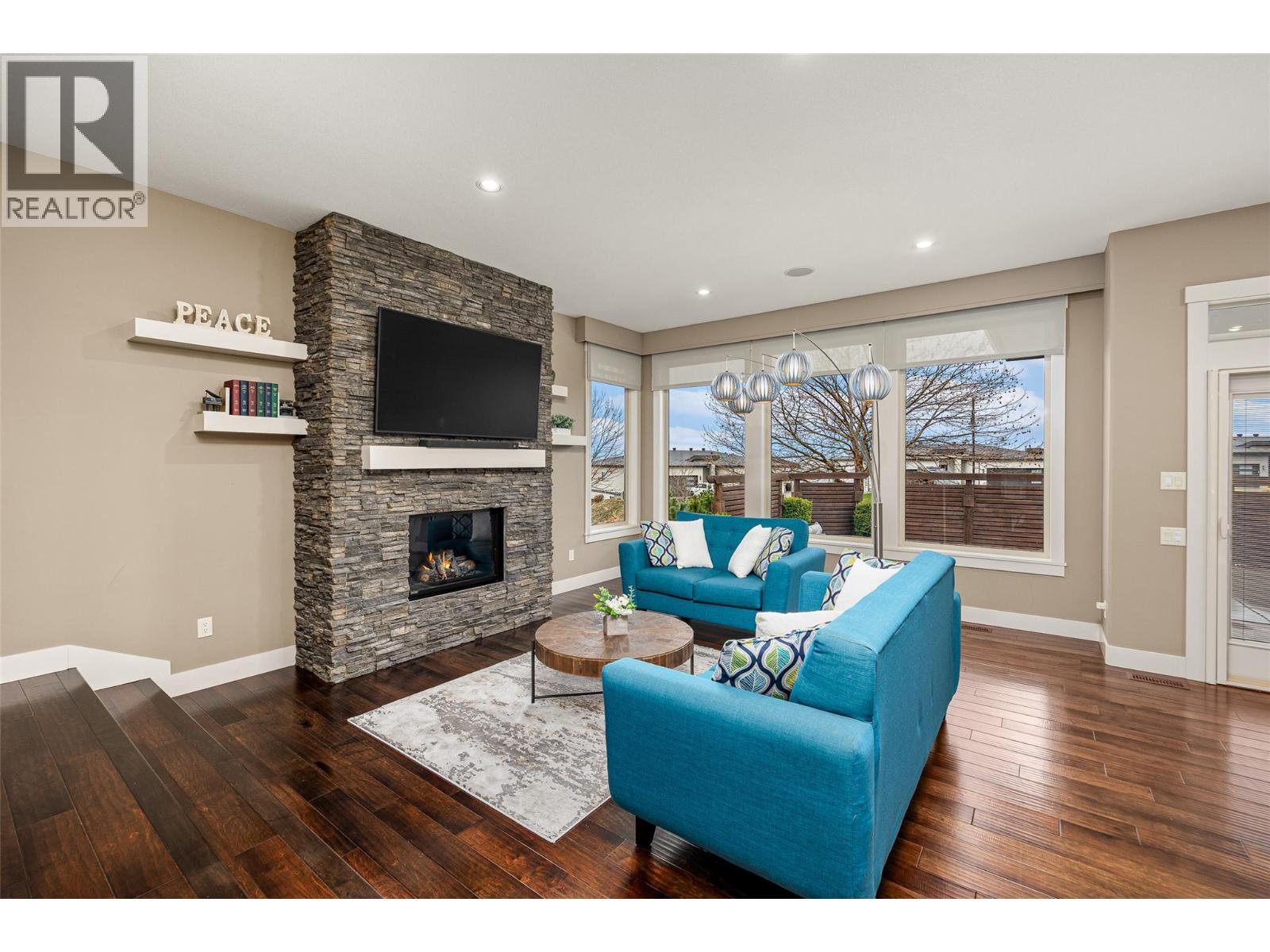 1768 Split Rail Place, Kelowna, BC - Indoor Photo Showing Living Room With Fireplace