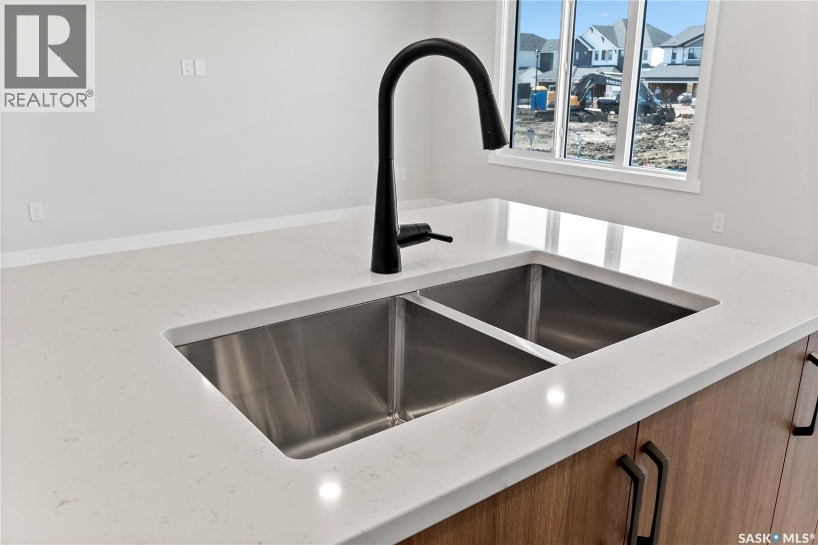 213 Yuel Lane, Saskatoon, SK - Indoor Photo Showing Kitchen With Double Sink
