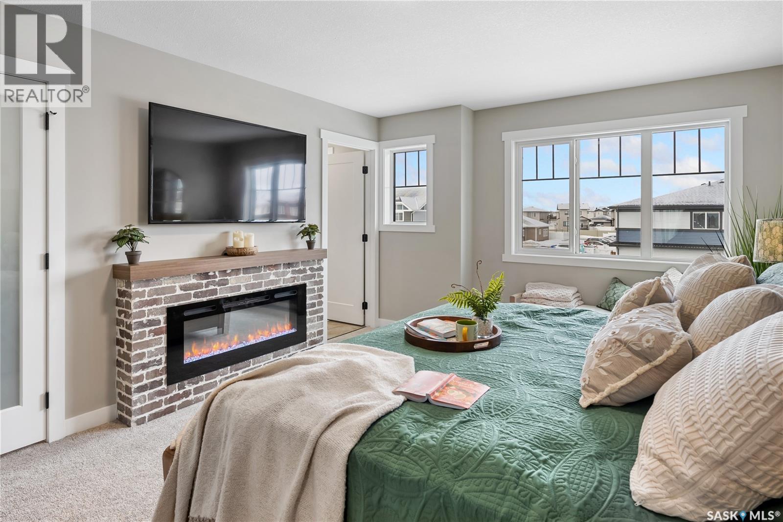 205 Yuel Lane, Saskatoon, SK - Indoor Photo Showing Living Room With Fireplace