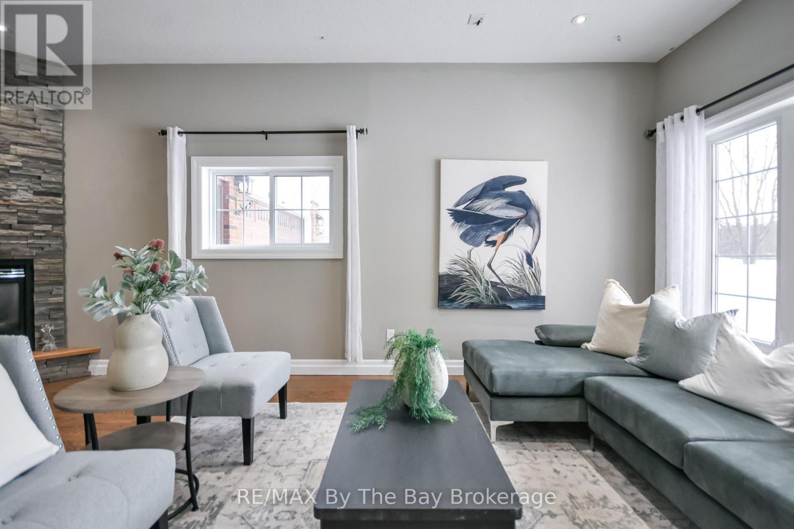 111 Balm Beach Road E, Tiny, ON - Indoor Photo Showing Living Room With Fireplace