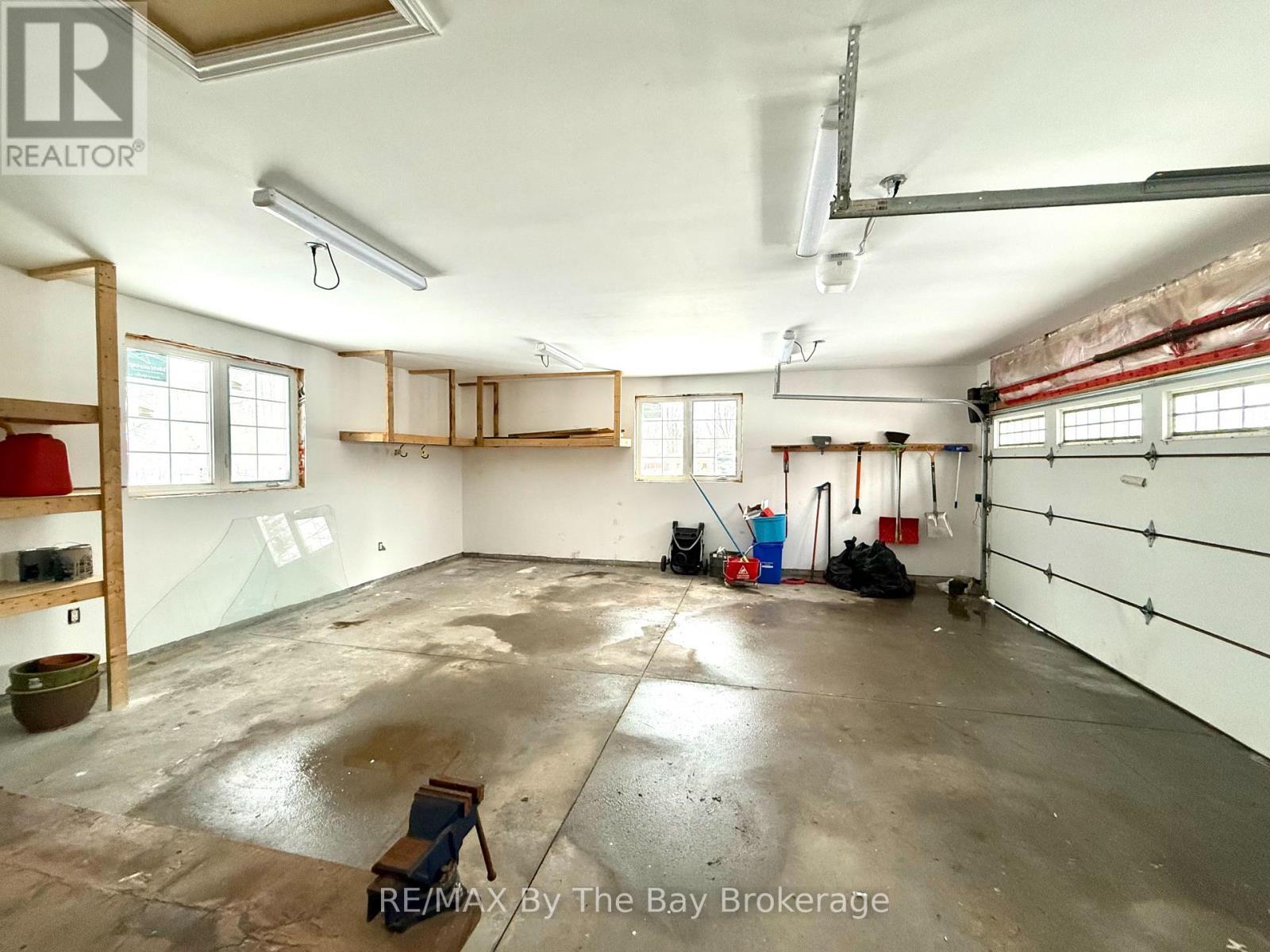 Garage - Large windows - 111 Balm Beach Road E, Tiny, ON - Indoor Photo Showing Garage
