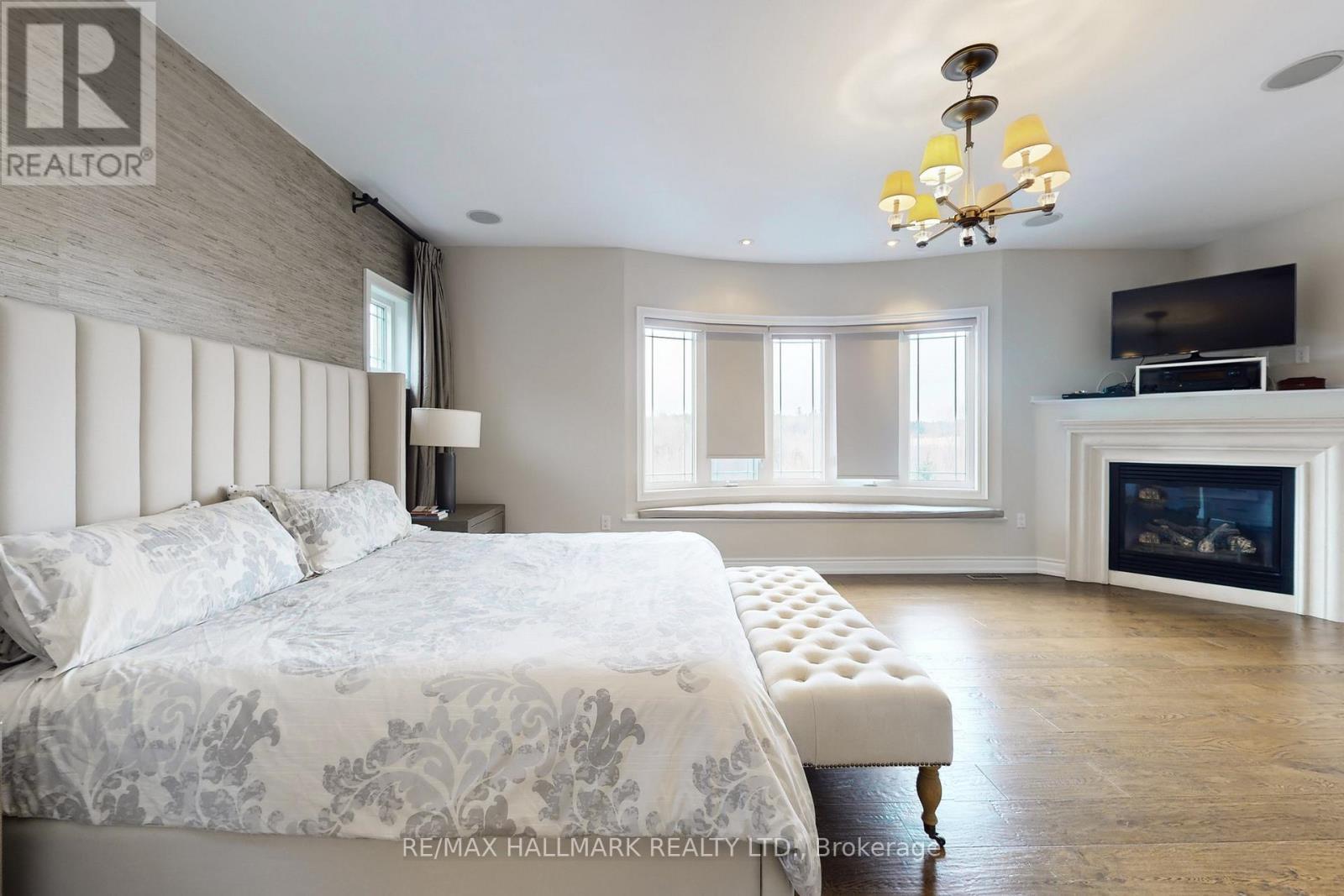 24 Bluff Trail, King, ON - Indoor Photo Showing Bedroom With Fireplace