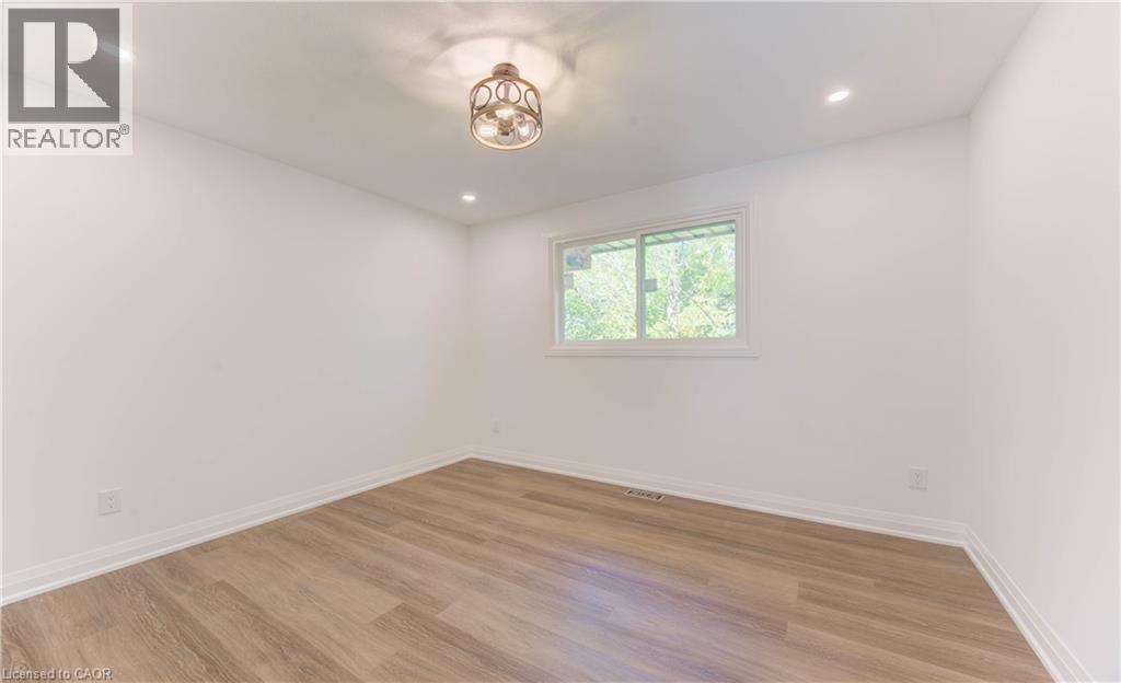 Unfurnished room featuring light wood-type flooring and recessed lighting - 90 Culpepper Drive, Waterloo, ON - Indoor Photo Showing Other Room