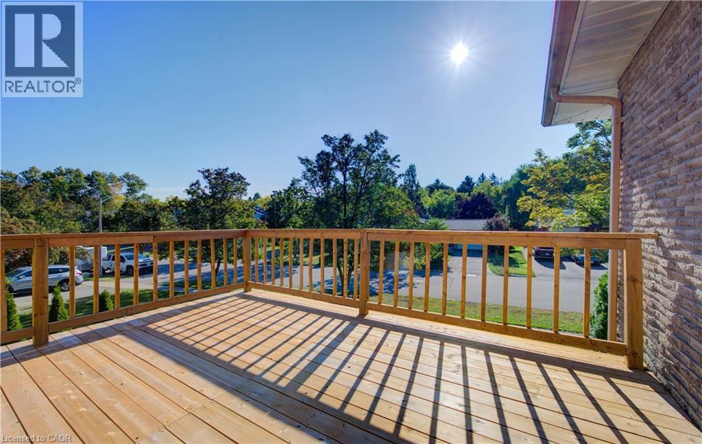Wooden terrace featuring view of scattered trees - 90 Culpepper Drive, Waterloo, ON - Outdoor With Deck Patio Veranda