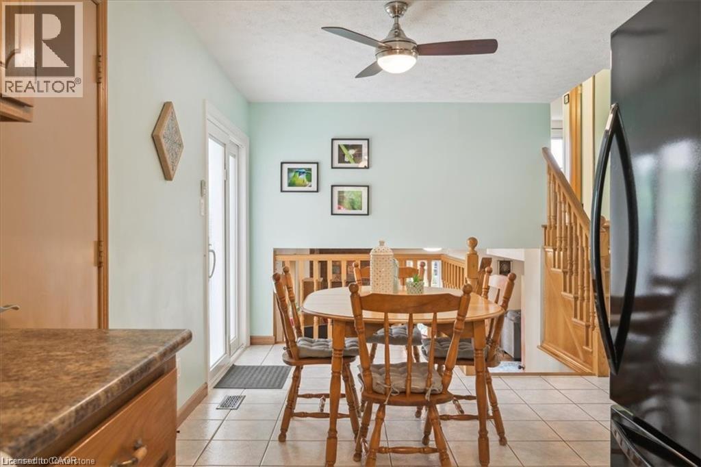 Dining room featuring a ceiling fan and light tile patterned floors - 47 Claycroft Crescent Unit# Upper, Kitchener, ON - Indoor Photo Showing Dining Room