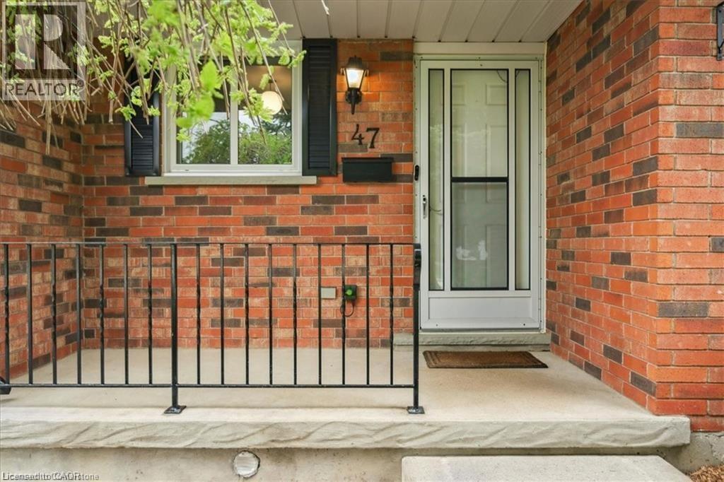 Entrance to property with brick siding and covered porch - 47 Claycroft Crescent Unit# Upper, Kitchener, ON - Outdoor With Exterior