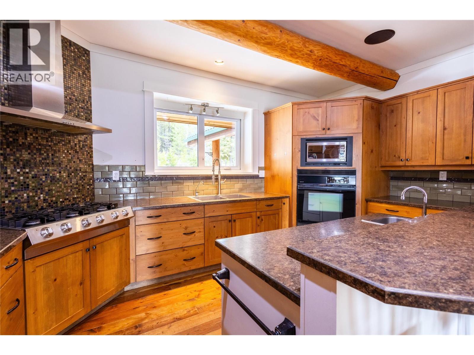 Log Home Kitchen - 475 Bluenose Road, Coldstream, BC