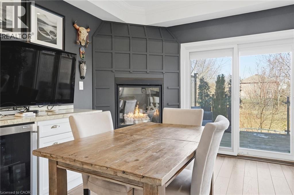 4020 Alexan Crescent, Burlington, ON - Indoor Photo Showing Dining Room With Fireplace
