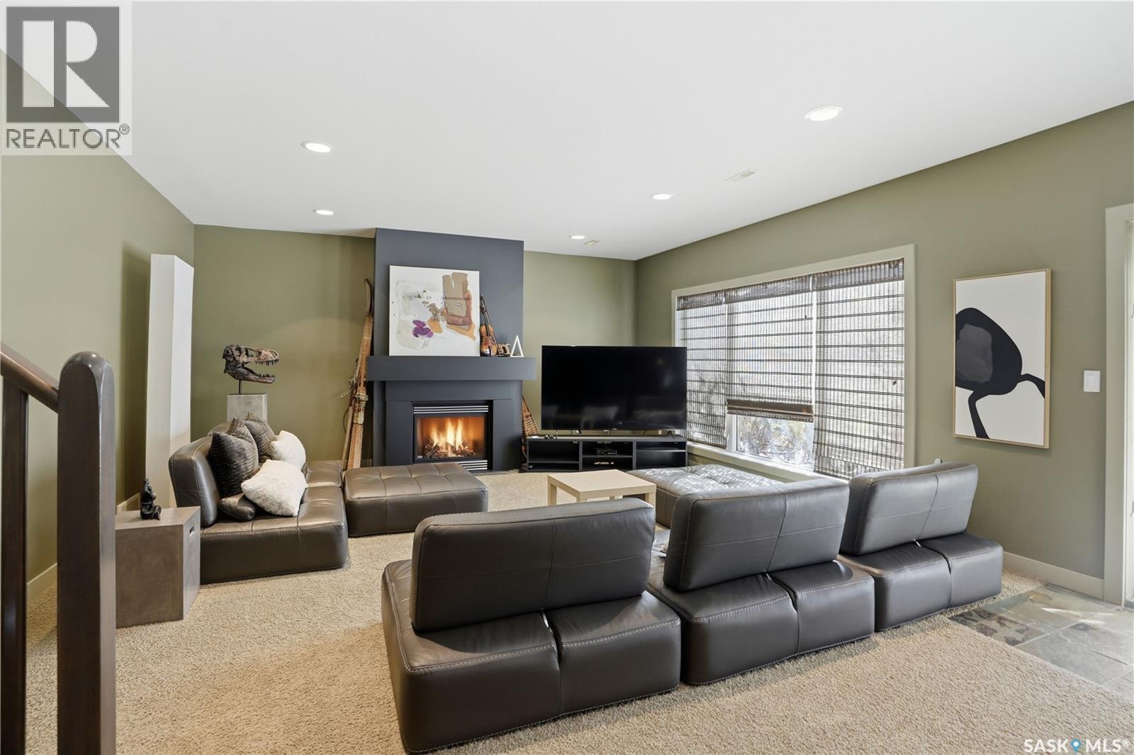 102 802 Heritage Crescent, Saskatoon, SK - Indoor Photo Showing Living Room With Fireplace