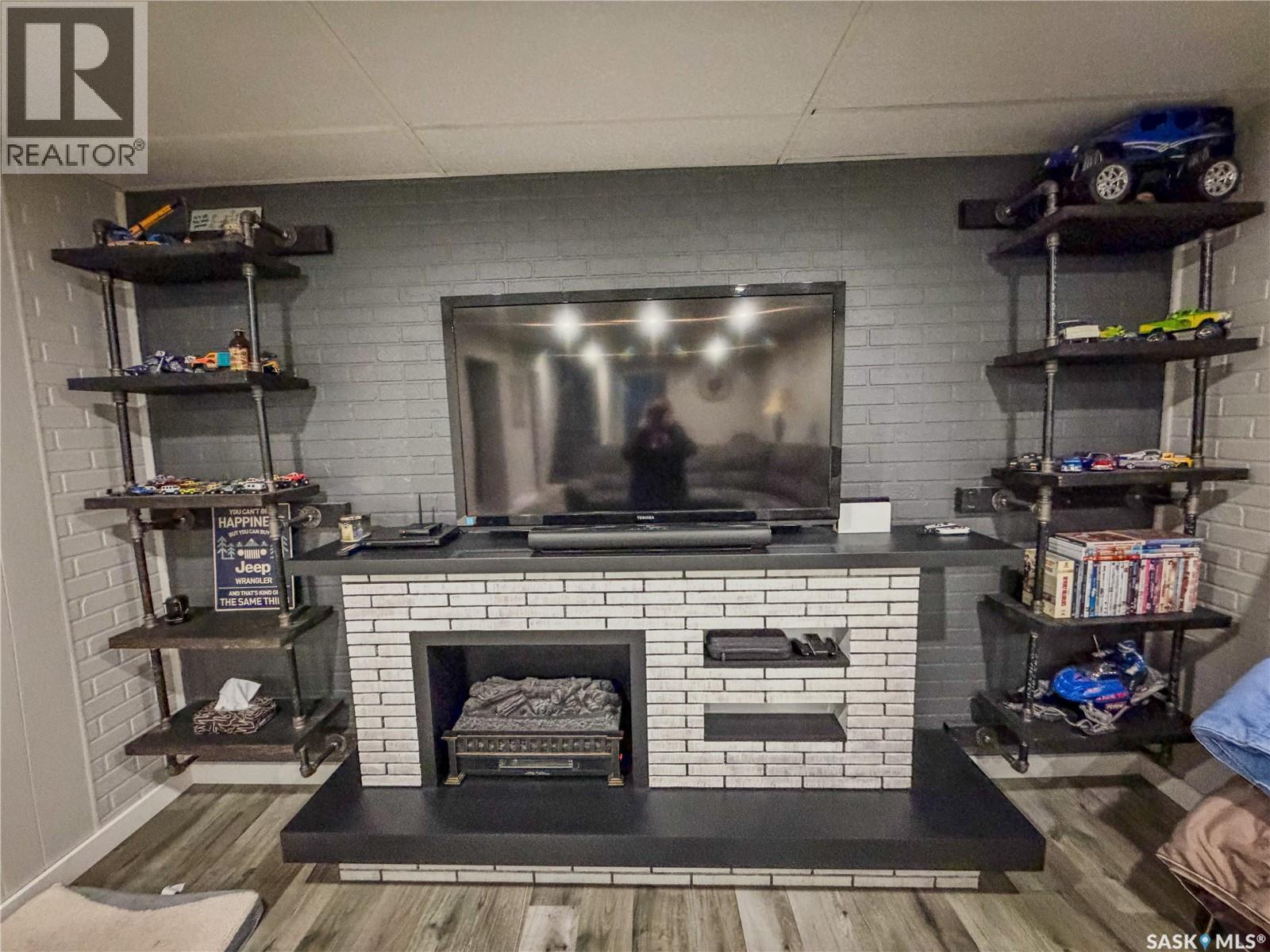 210 Wells Avenue E, Langenburg, SK - Indoor With Fireplace