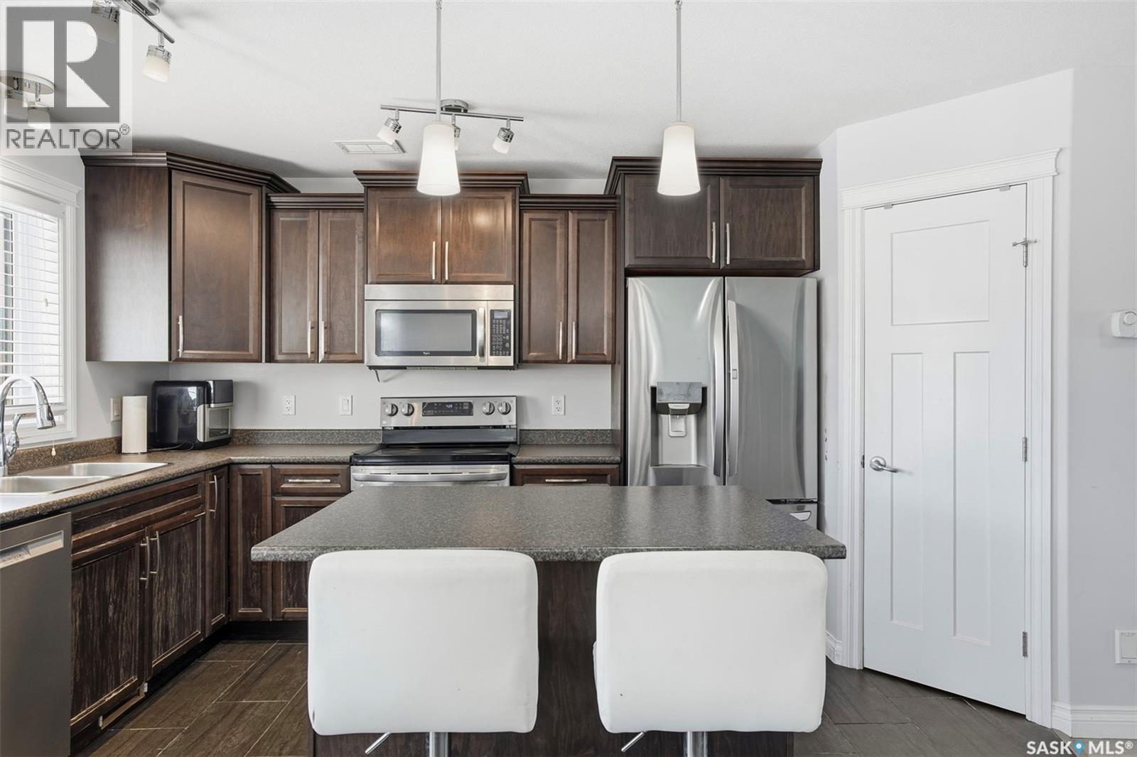 215 Wyant Lane, Saskatoon, SK - Indoor Photo Showing Kitchen With Double Sink