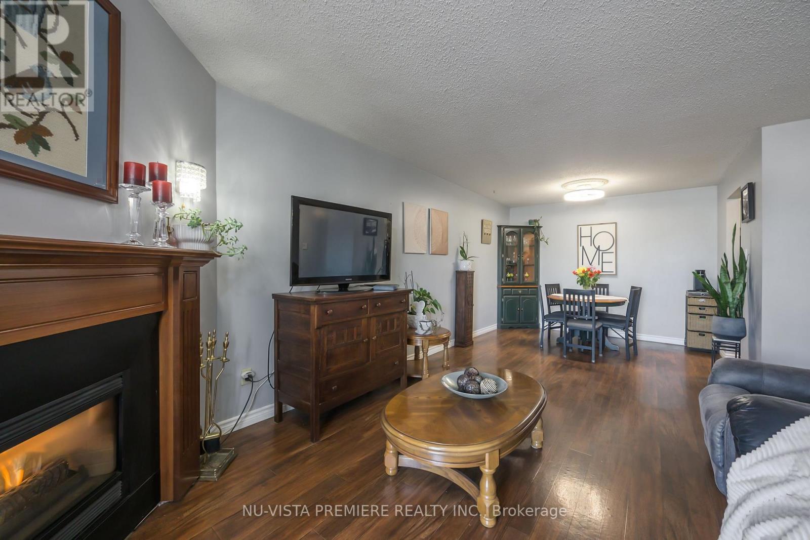 119 - 725 Deveron Crescent, London South (South T), ON - Indoor Photo Showing Living Room With Fireplace