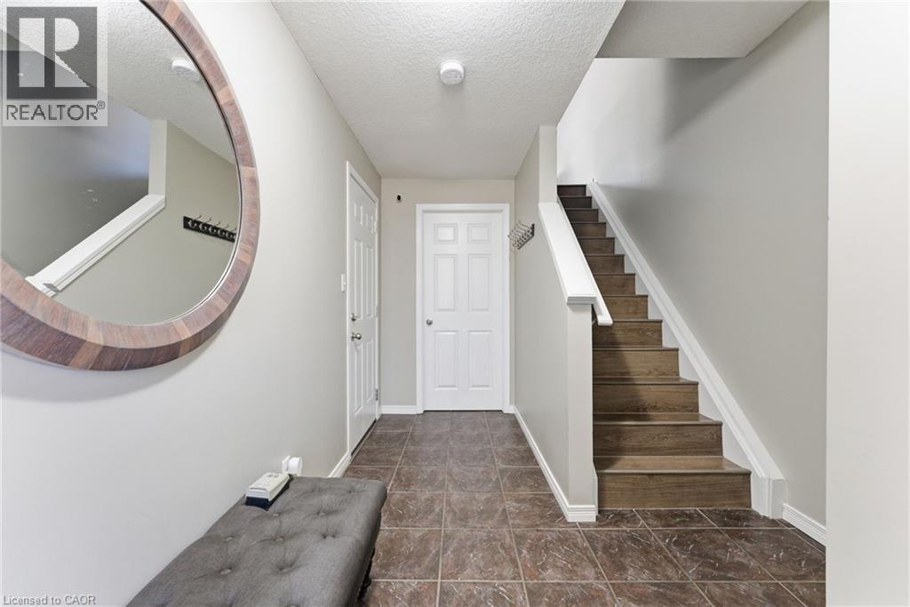 Entrance foyer with stairs and a textured ceiling - 208 Templewood Drive, Kitchener, ON - Indoor Photo Showing Other Room