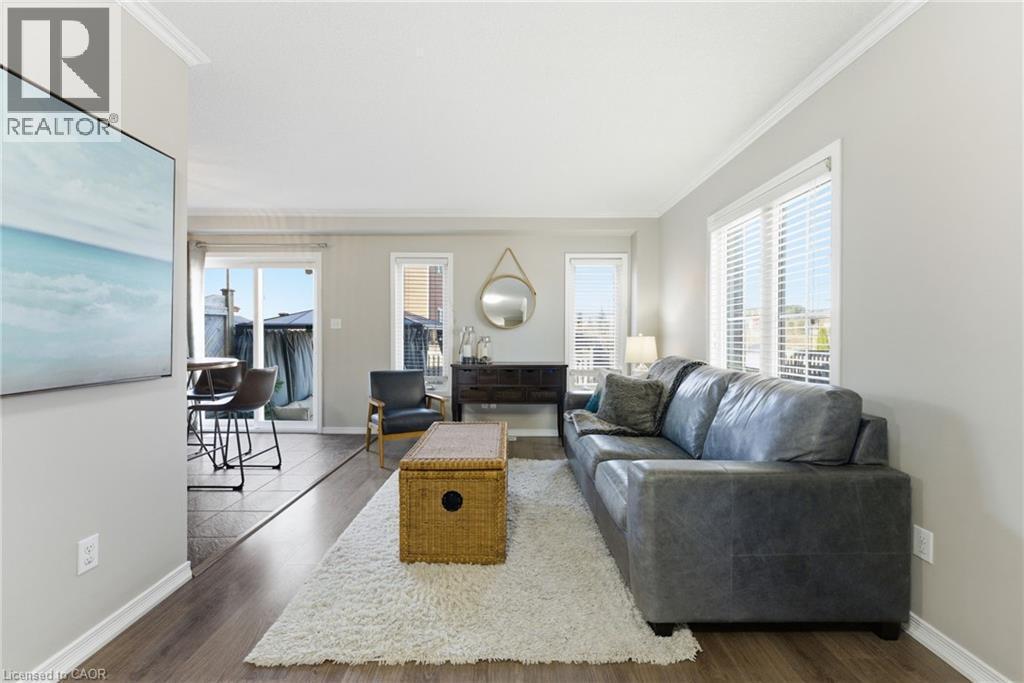 Living area with dark wood-style floors and crown molding - 208 Templewood Drive, Kitchener, ON - Indoor Photo Showing Living Room