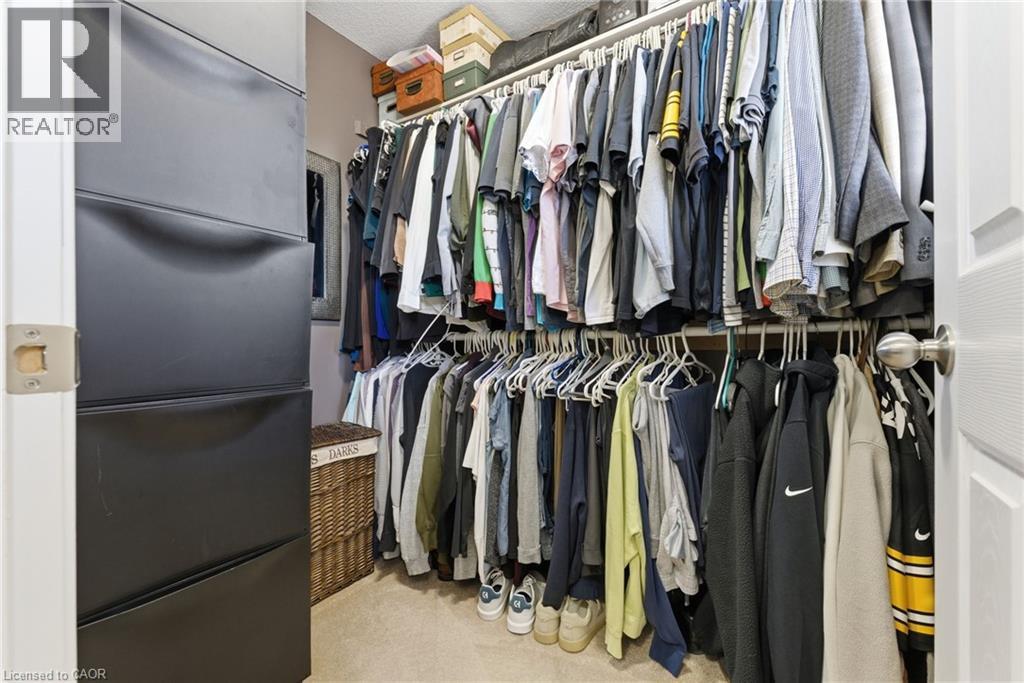 Walk in closet with light colored carpet - 208 Templewood Drive, Kitchener, ON - Indoor With Storage
