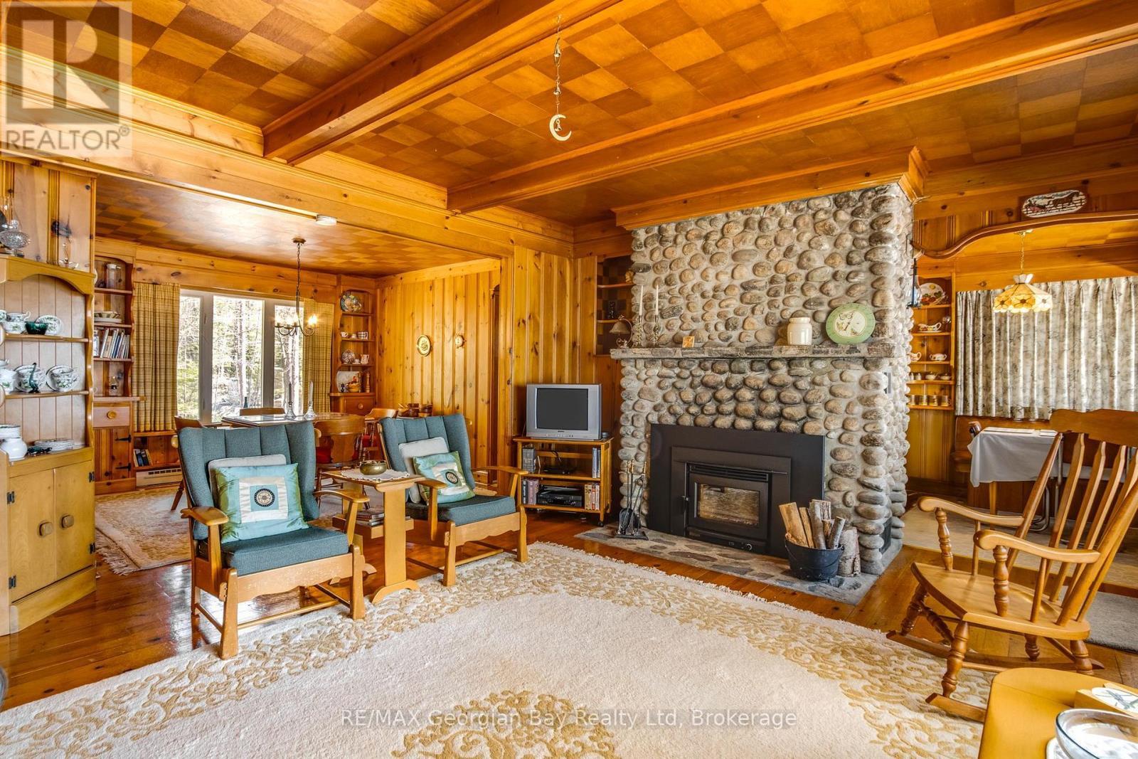 750 Tiny Beaches Road S, Tiny, ON - Indoor Photo Showing Living Room With Fireplace